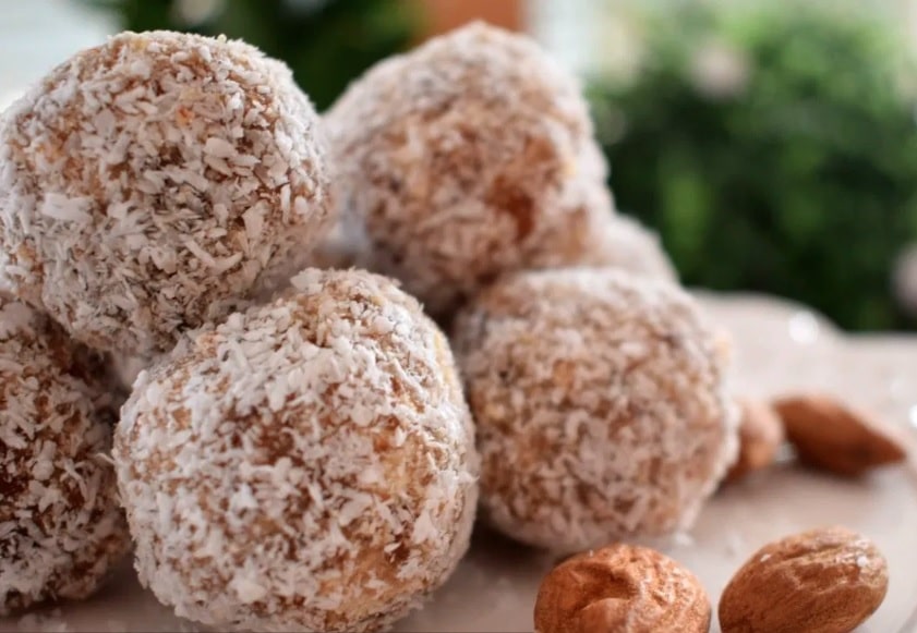 Almond unbaked balls wrapped in coconut