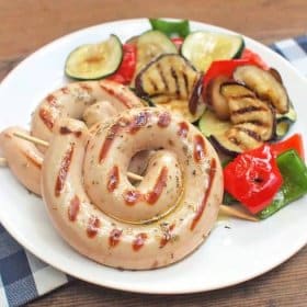 Plate with roasted wine sausage and vegetables