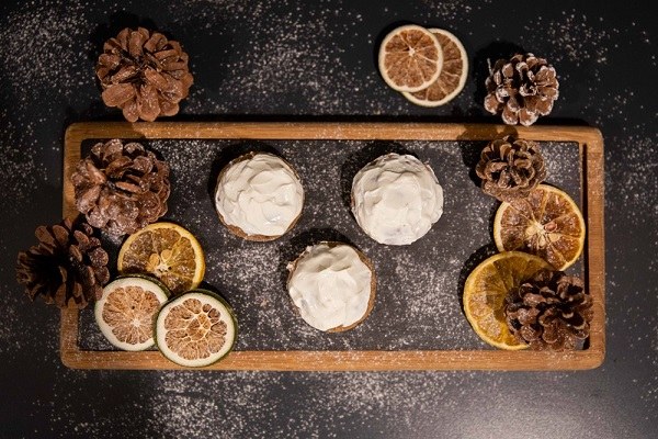 Dog candy in the shape of balls with white frosting