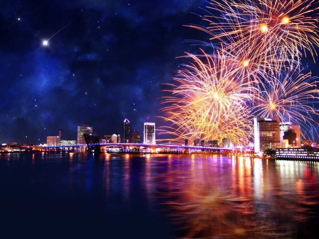 Image with city view, night sky and fireworks.