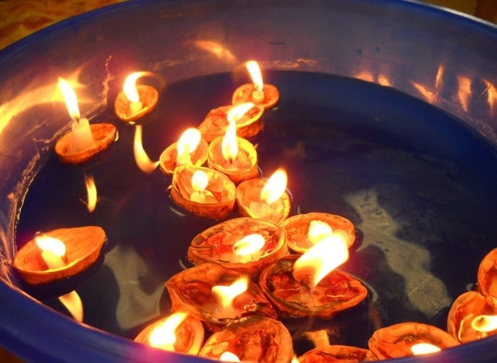 Nutty Christmas boats floating in a bowl.