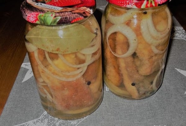 Baked carp in vinegar marinade with onions