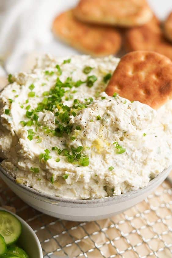 A bowl with a creamy celery and sweet apple spread for sandwiches.