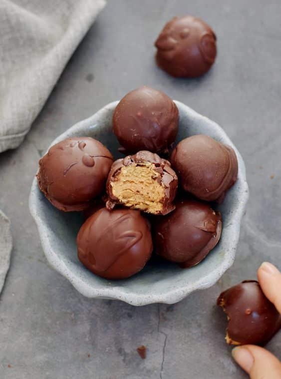 Chocolate covered balls with peanut butter inside.