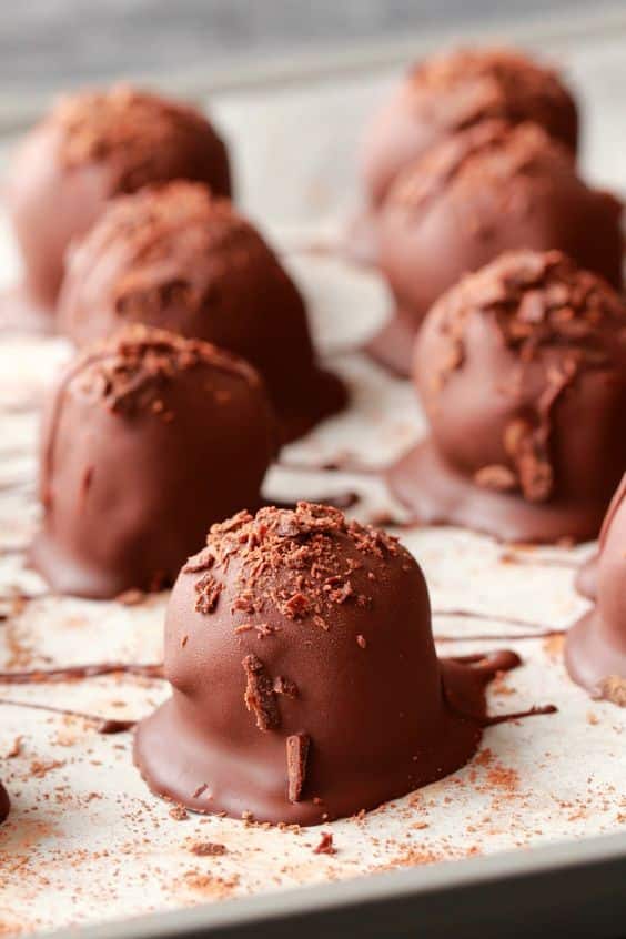 Chocolate balls sprinkled with cocoa.