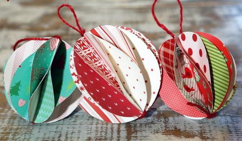 Three colorful paper Christmas decorations.
