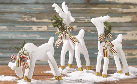 Decoration under the tree - reindeer with glitter.