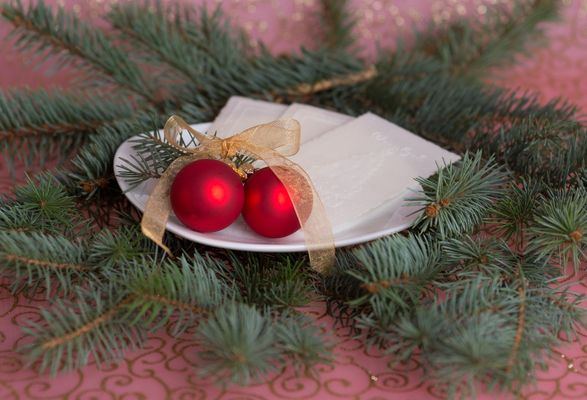 Gluten-free wafers on a plate with Christmas decorations.