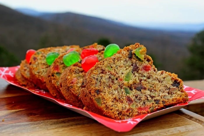 Sliced fruit sandwich with candied fruit.