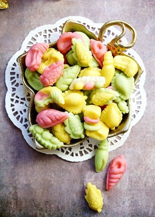 Marzipan shells of various shapes and colors.