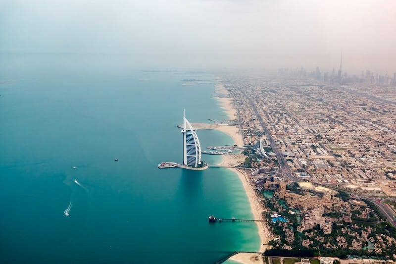 Dubai and its combination of beaches and luxury resorts, with a view of the huge city.