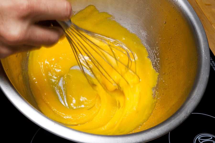 whipping the yolk cream with a whisk