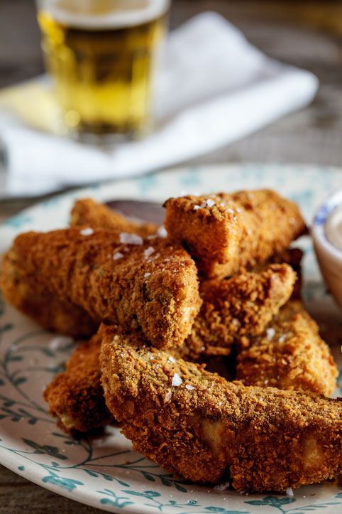 Crispy fish fries served on a decorative plate