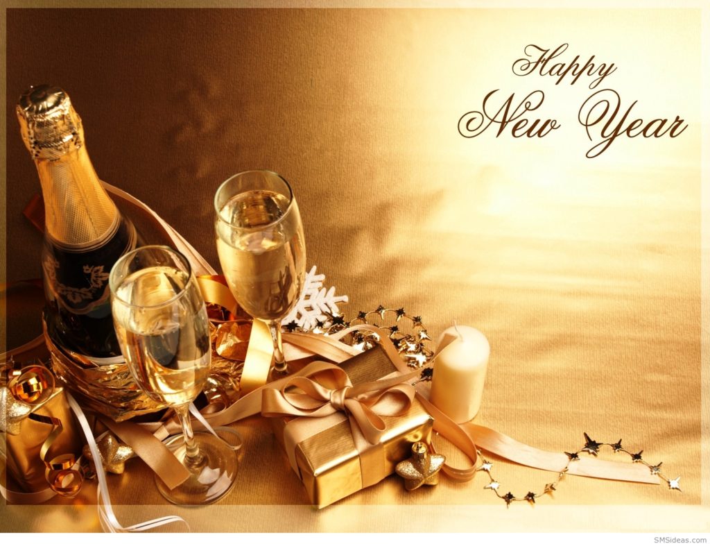 Two full champagne glasses with a bottle of champagne and Happy New Year lettering on a gold pictorial Christmas card.