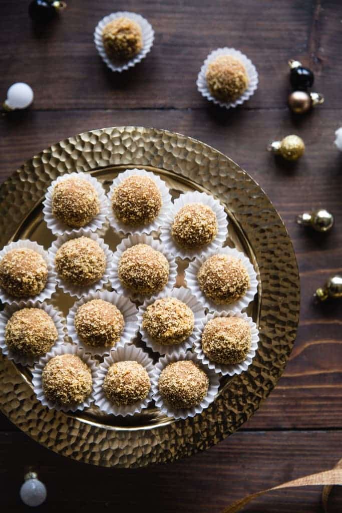 Christmas balls made of honey, caramel salk and walnuts in baskets.