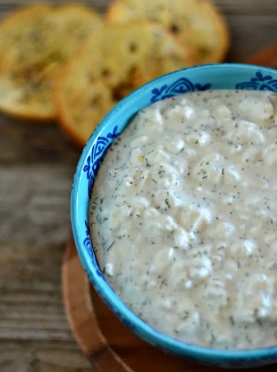 Cheese spread with horseradish in a blue bowl