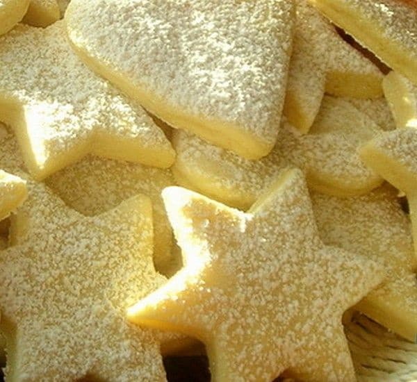 Star-shaped lemon cookies sprinkled with sugar.