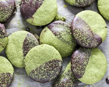 Green Christmas cookies dipped in chocolate.