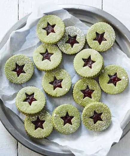 Green gummy cookies filled with jam.