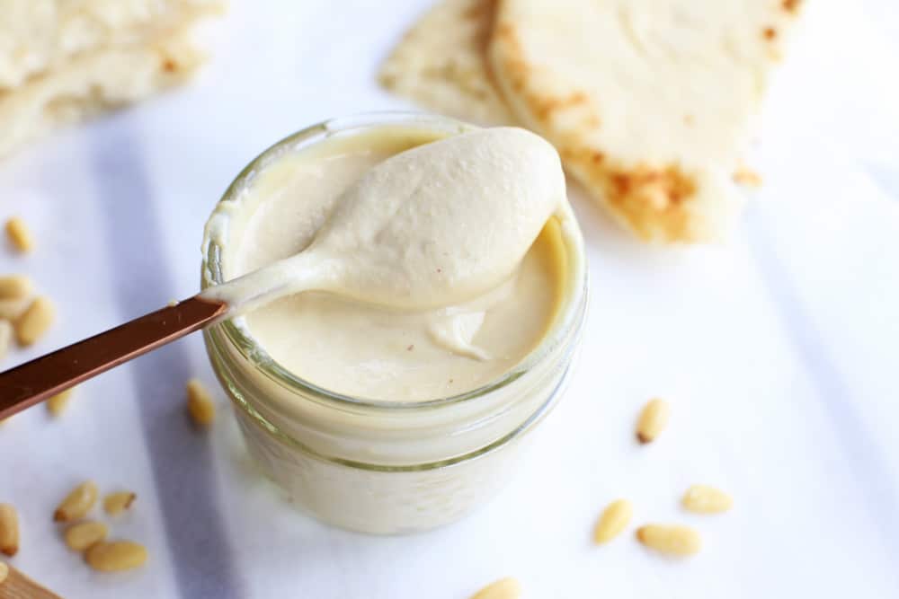 Traditional Christmas nut cream in a glass with a spoon.