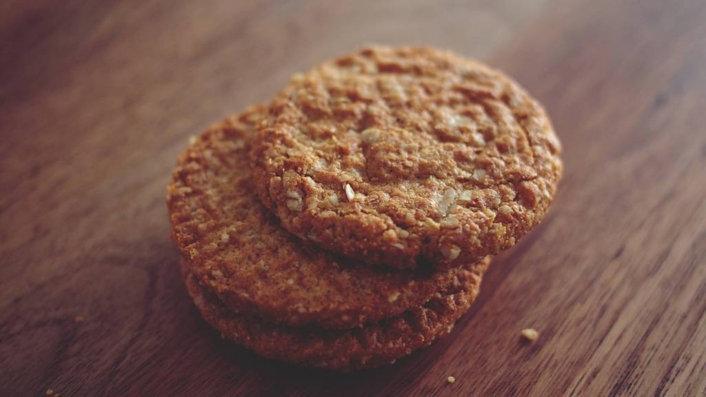 Christmas oatmeal cookies with coconut stacked on top of each other