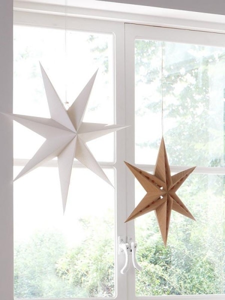 Paper Christmas star outside the window.