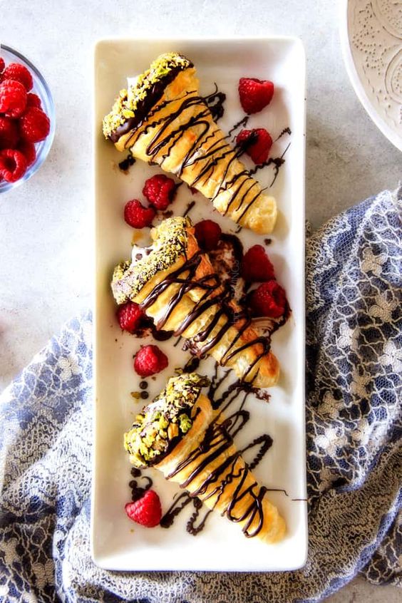 Fluffy short pastry tubes filled with cream and raspberries.