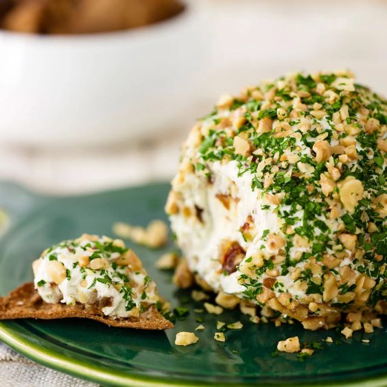 Cheese ball with nuts and parsley.