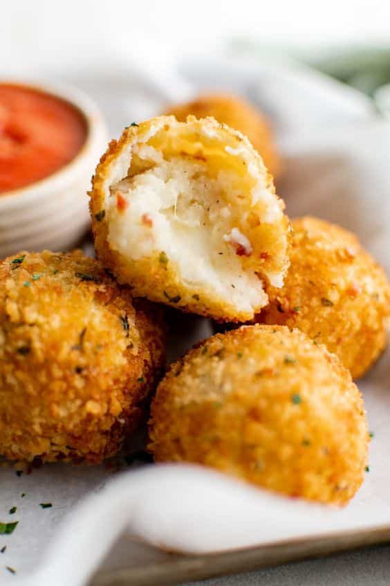 Fried balls filled with cheese and potatoes.