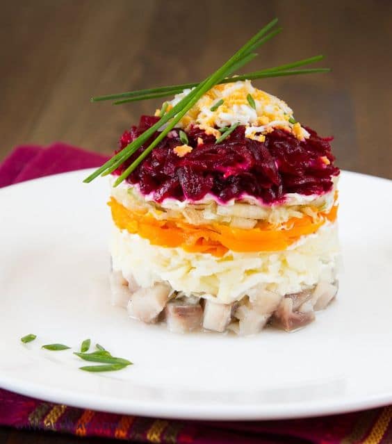 Russian Christmas vegetable salad with herring.