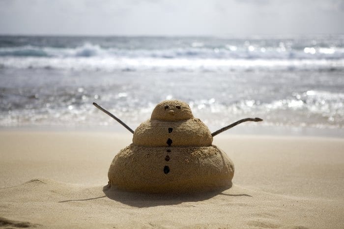 A snowman in the sand on the Hawaiian Islands.