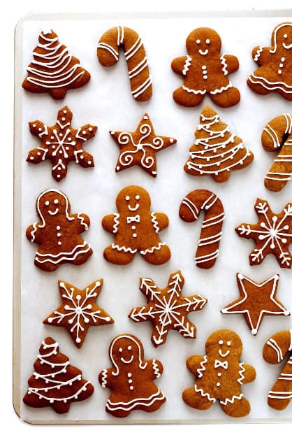 Gingerbread cookies of various shapes decorated with icing.